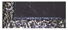 A close up of the bottom of a black surface