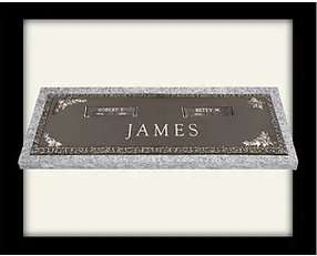 A black plaque with white lettering and silver border.