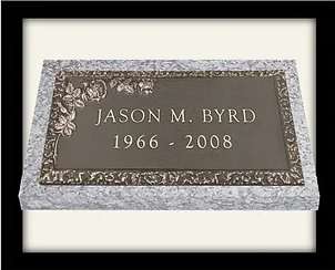 A plaque with the name of a person and date.