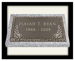 A plaque with the name of an individual and date.