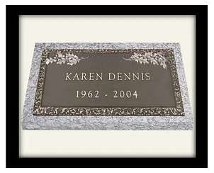 A plaque with the name of a person and date.
